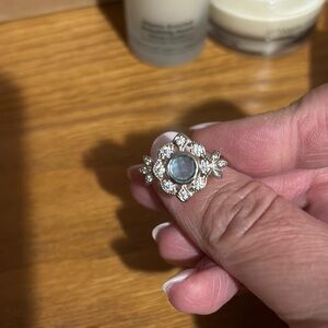 Elegant Silver Floral Ring with Blue Gemstone